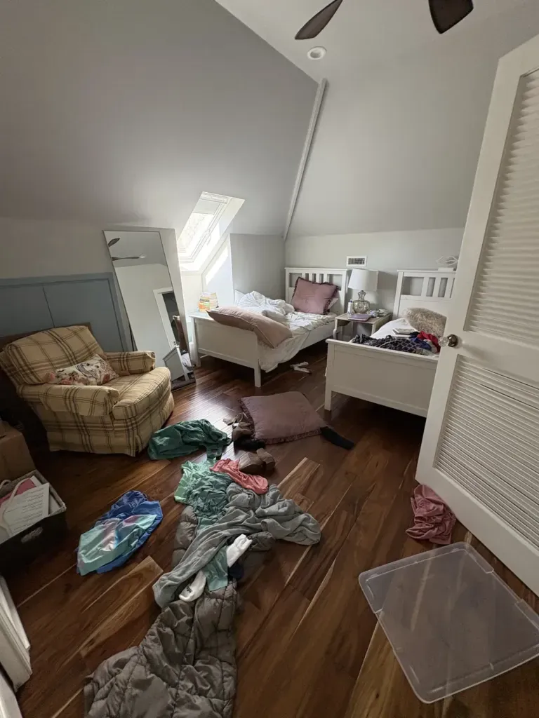 cluttered attic bedroom before decluttering, Winchester VA