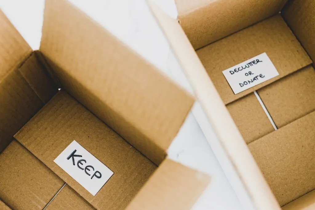 storage boxes labeled keep and declutter or donate for sorting during decluttering, Winchester VA