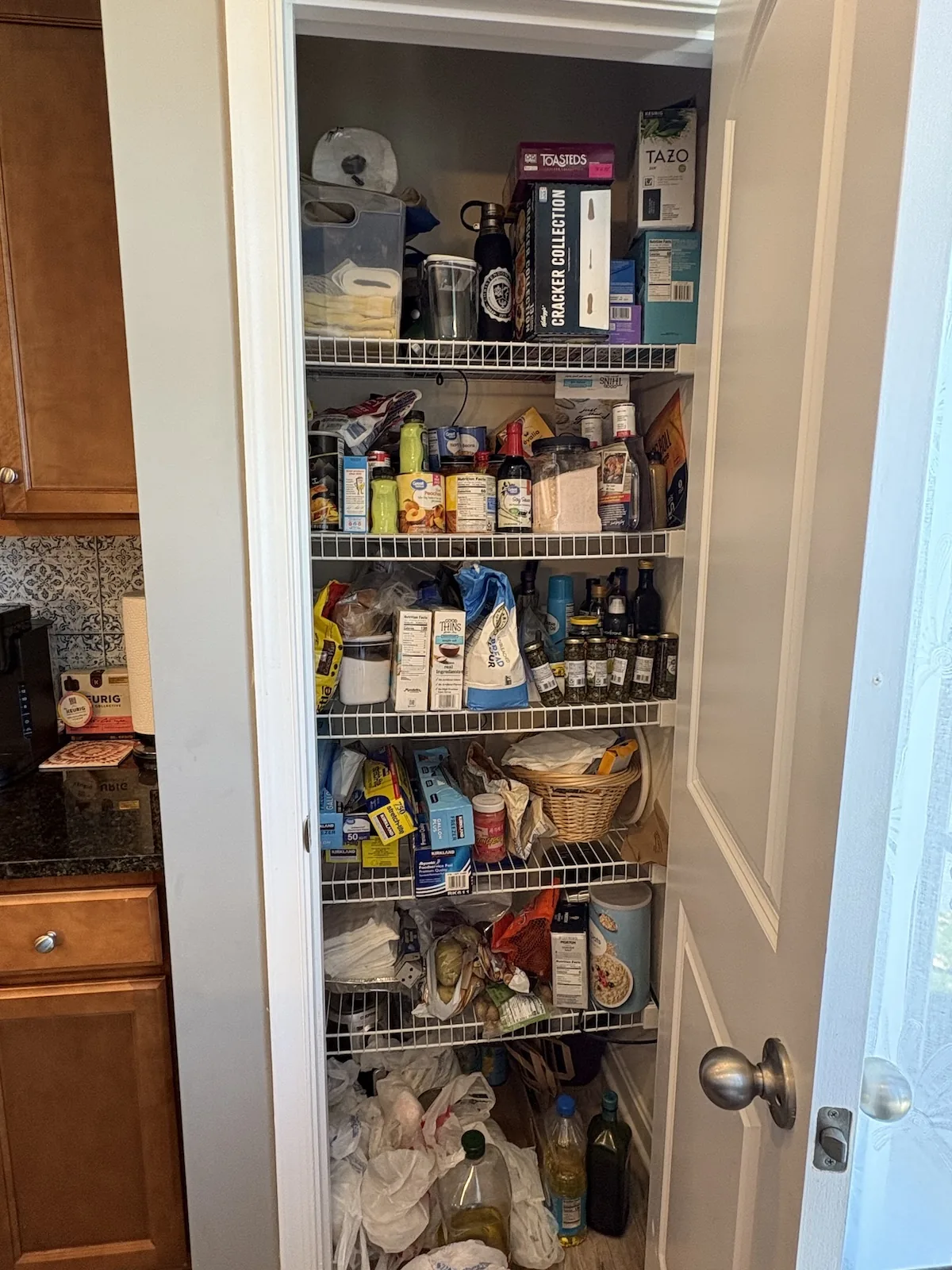 Cluttered pantry before professional home organization in Front Royal, Virginia
