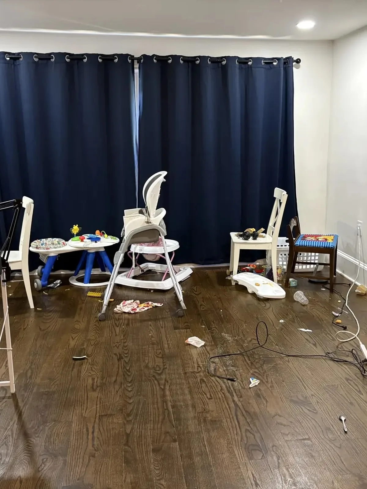 Cluttered family playroom before professional organization in Front Royal, Virginia